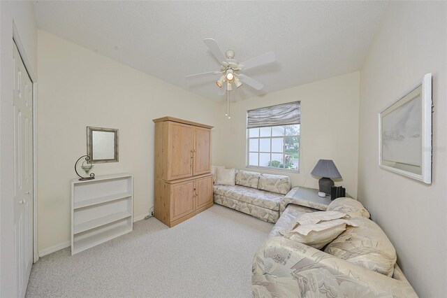 1012 Radison Lake Ct Unit 59, Sun City Center, FL 33573 - living area featuring light carpet, ceiling fan, and baseboards
