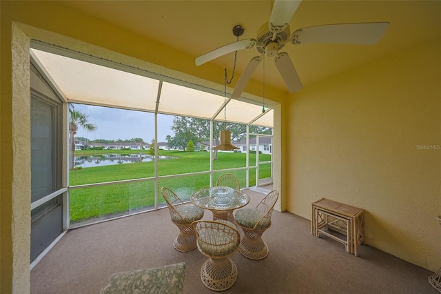 1012 Radison Lake Ct Unit 59, Sun City Center, FL 33573 - sunroom with ceiling fan and a water view