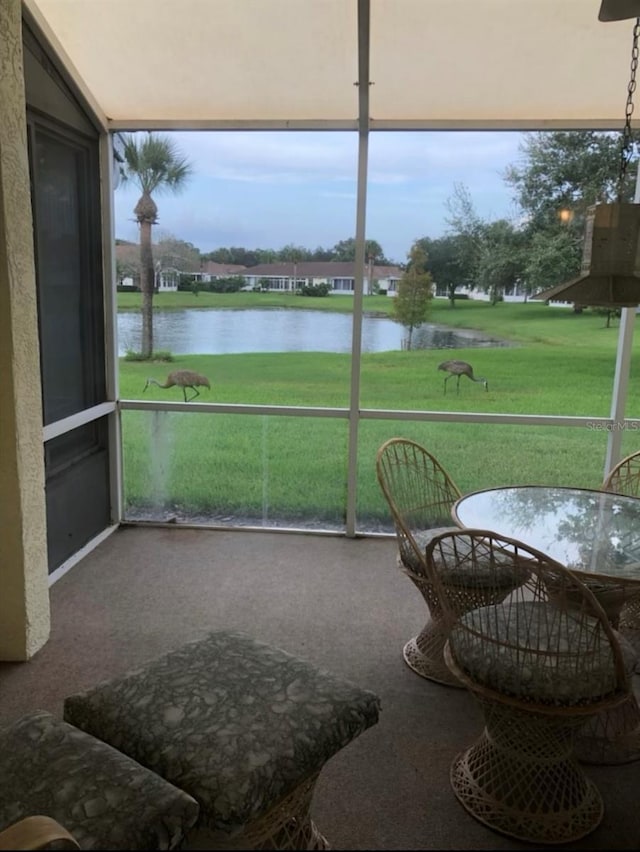 1012 Radison Lake Ct Unit 59, Sun City Center, FL 33573 - sunroom with a water view