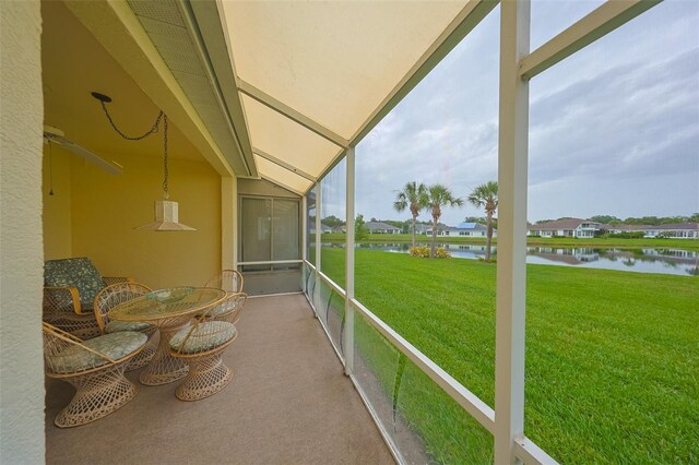 1012 Radison Lake Ct Unit 59, Sun City Center, FL 33573 - sunroom with a water view and a residential view