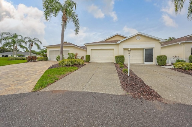 1012 Radison Lake Ct Unit 59, Sun City Center, FL 33573 - ranch-style house with driveway and stucco siding