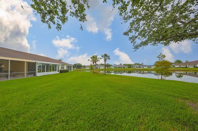 1012 Radison Lake Ct Unit 59, Sun City Center, FL 33573 - view of green lawn with a water view and a residential view