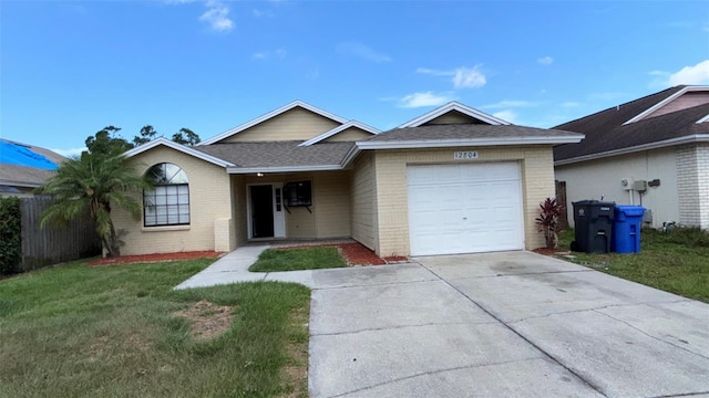 12804 Millridge Forest St, Tampa, FL 33624 - single story home with brick siding, concrete driveway, a garage, and roof with shingles
