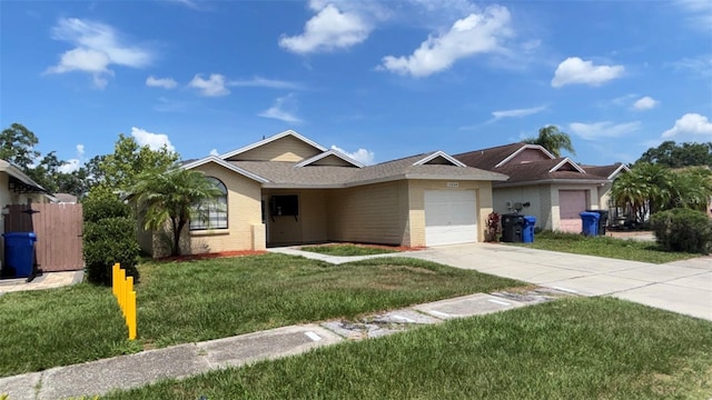 12804 Millridge Forest St, Tampa, FL 33624 - single story home featuring a garage, driveway, brick siding, and a front yard