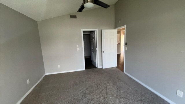 12804 Millridge Forest St, Tampa, FL 33624 - unfurnished bedroom with baseboards, dark colored carpet, a ceiling fan, and high vaulted ceiling