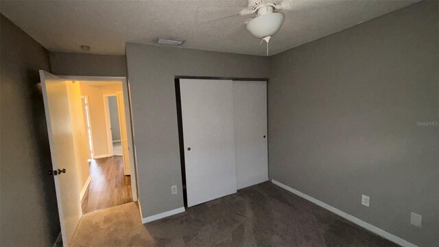 12804 Millridge Forest St, Tampa, FL 33624 - unfurnished bedroom with a closet, baseboards, carpet flooring, and ceiling fan