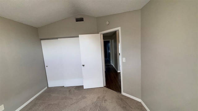 12804 Millridge Forest St, Tampa, FL 33624 - unfurnished bedroom featuring vaulted ceiling, carpet floors, baseboards, and a closet