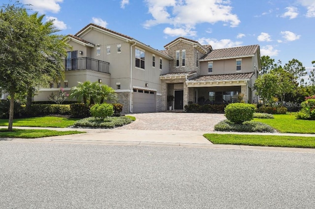 9080 Morgana Ct, Winter Garden, FL 34787 - view of front of house featuring stone siding, driveway, an attached garage, and a tile roof