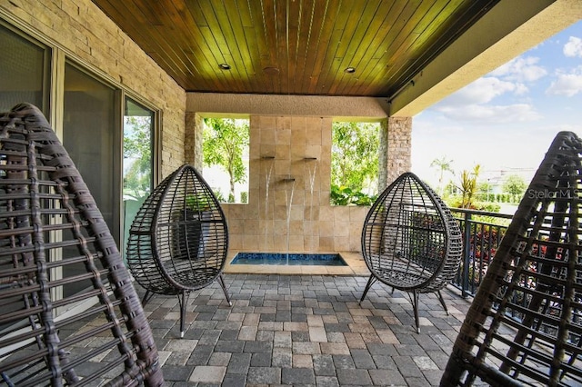 9080 Morgana Ct, Winter Garden, FL 34787 - view of patio featuring exterior fireplace and a balcony