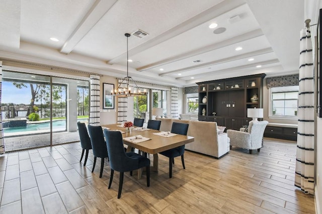 9080 Morgana Ct, Winter Garden, FL 34787 - dining space featuring light wood-style floors, beamed ceiling, and a chandelier