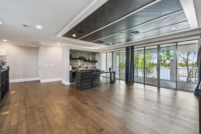 9080 Morgana Ct, Winter Garden, FL 34787 - living area with baseboards, dark wood finished floors, ornamental molding, recessed lighting, and a fireplace