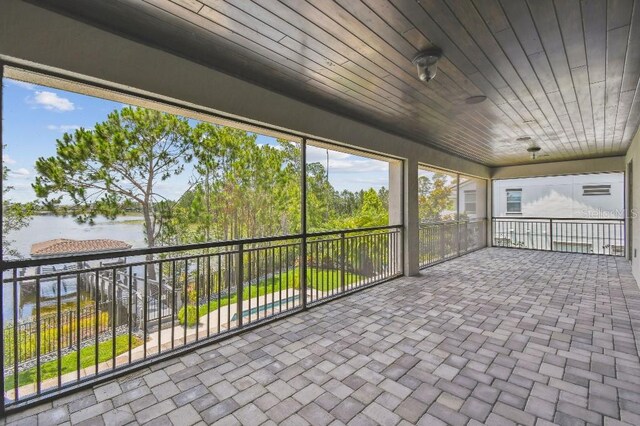 9080 Morgana Ct, Winter Garden, FL 34787 - unfurnished sunroom featuring a water view
