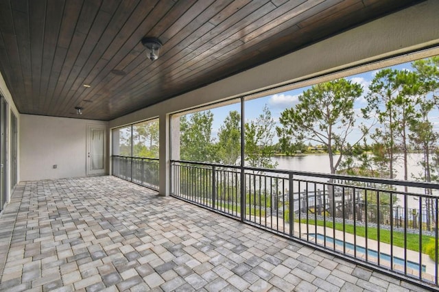 9080 Morgana Ct, Winter Garden, FL 34787 - unfurnished sunroom featuring a water view