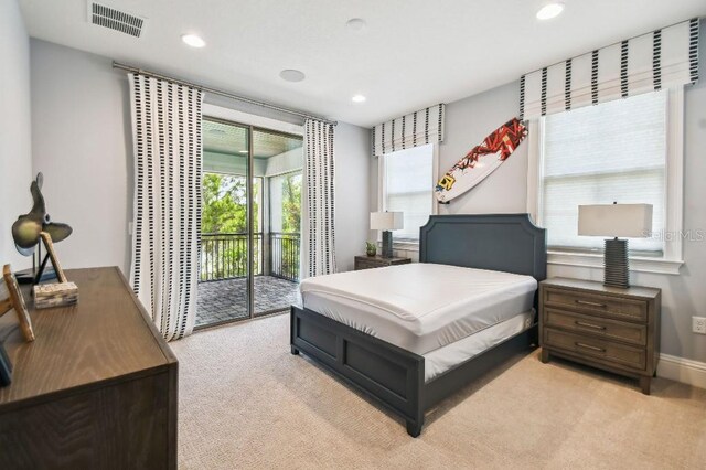 9080 Morgana Ct, Winter Garden, FL 34787 - bedroom with light carpet, access to exterior, multiple windows, and recessed lighting