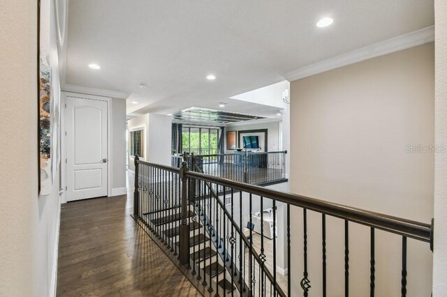 9080 Morgana Ct, Winter Garden, FL 34787 - corridor featuring an upstairs landing, ornamental molding, recessed lighting, dark wood-type flooring, and baseboards