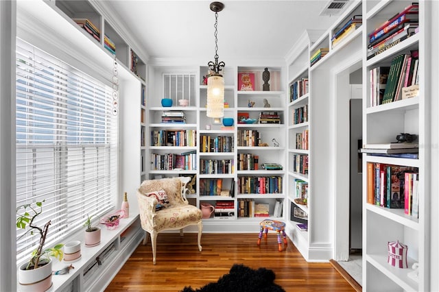 4012 N Munro St, Tampa, FL 33603 - living area with plenty of natural light, wood finished floors, and crown molding