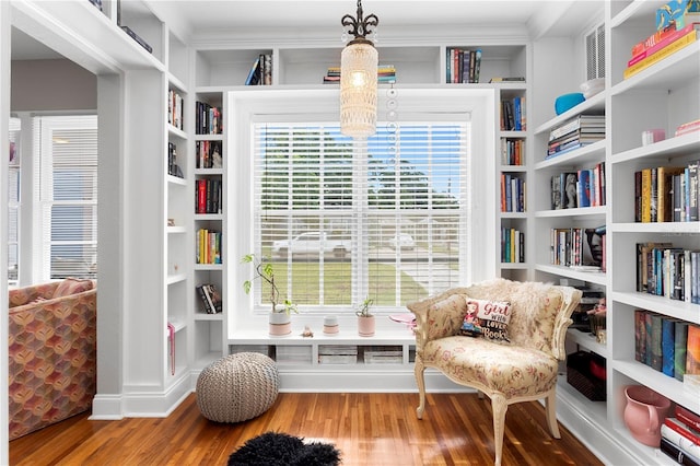 4012 N Munro St, Tampa, FL 33603 - living area with wood finished floors, crown molding, and built in shelves