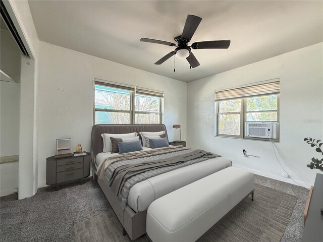 412 73rd Ave, St Pete Beach, FL 33706 - carpeted bedroom featuring multiple windows, ceiling fan, cooling unit, and a closet