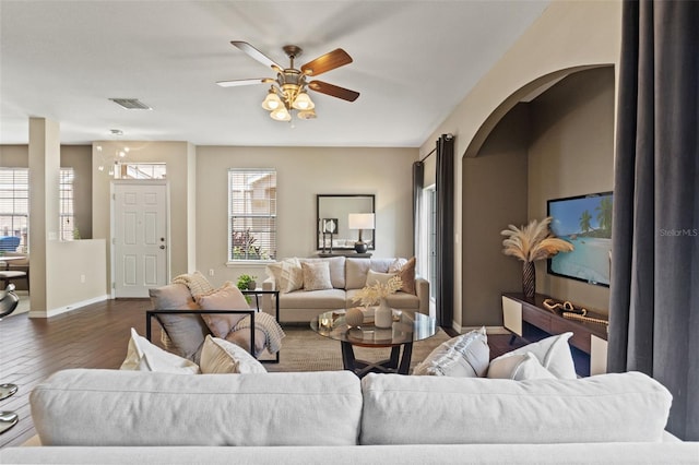 589 52nd Ave N, Saint Petersburg, FL 33703 - living area featuring wood finished floors, ceiling fan, and baseboards