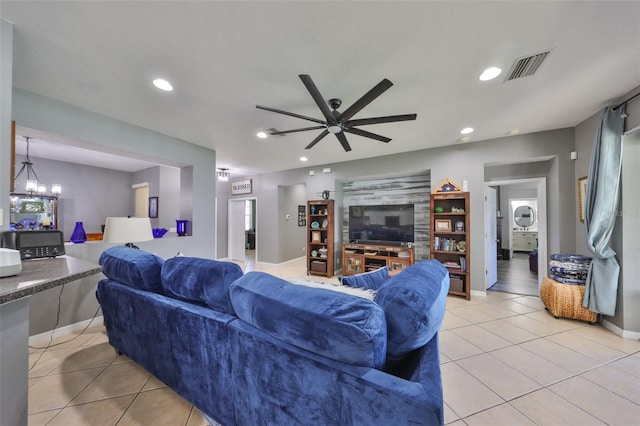 11806 Holly Crest Ln, Riverview, FL 33569 - living room with light tile patterned floors, recessed lighting, ceiling fan, baseboards, and a chandelier