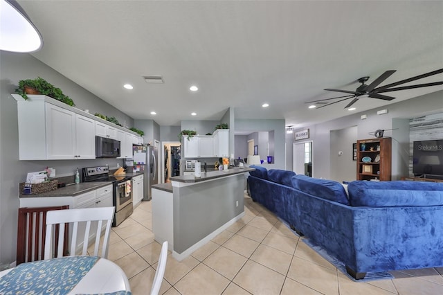 11806 Holly Crest Ln, Riverview, FL 33569 - kitchen with stainless steel appliances, open floor plan, dark countertops, and recessed lighting