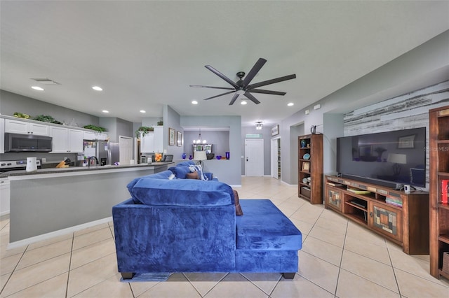 11806 Holly Crest Ln, Riverview, FL 33569 - living area with light tile patterned floors, a ceiling fan, recessed lighting, a chandelier, and baseboards