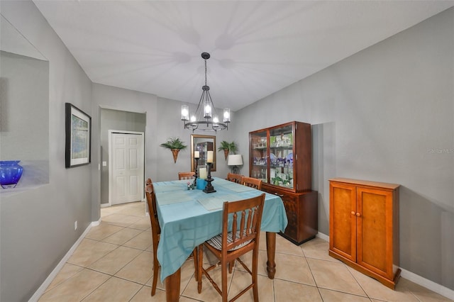 11806 Holly Crest Ln, Riverview, FL 33569 - dining area featuring a chandelier, light tile patterned flooring, and baseboards