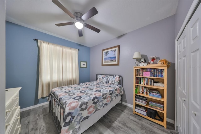 11806 Holly Crest Ln, Riverview, FL 33569 - bedroom with wood finished floors, baseboards, a closet, and a ceiling fan