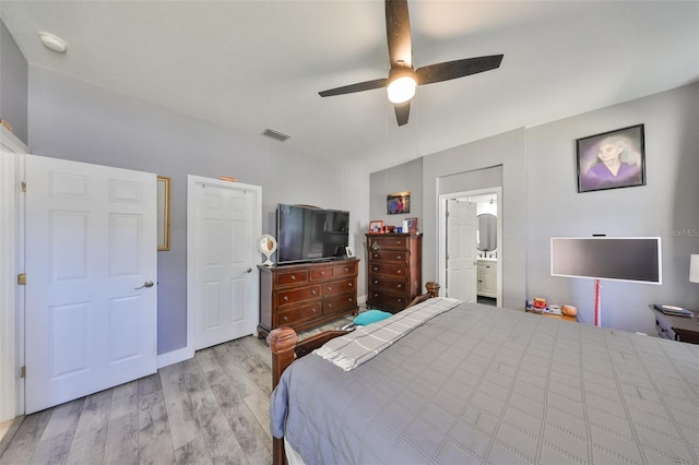 11806 Holly Crest Ln, Riverview, FL 33569 - bedroom featuring wood finished floors, a ceiling fan, and ensuite bathroom