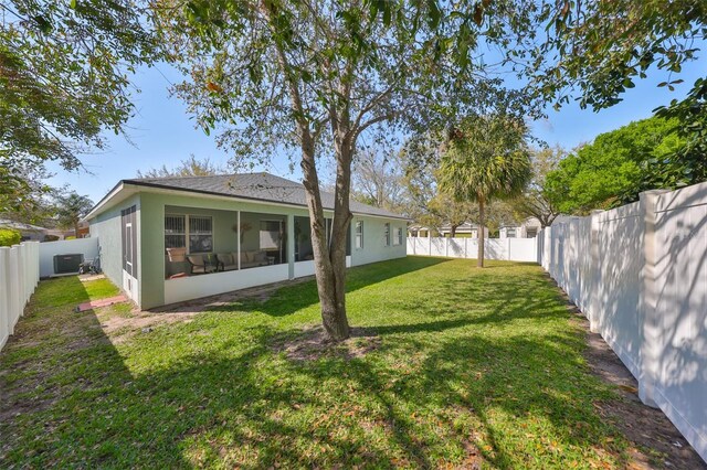 11806 Holly Crest Ln, Riverview, FL 33569 - rear view of property with stucco siding, a sunroom, and central AC