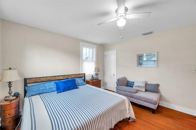 320 Broadway, Dunedin, FL 34698 - bedroom featuring wood finished floors, baseboards, and ceiling fan