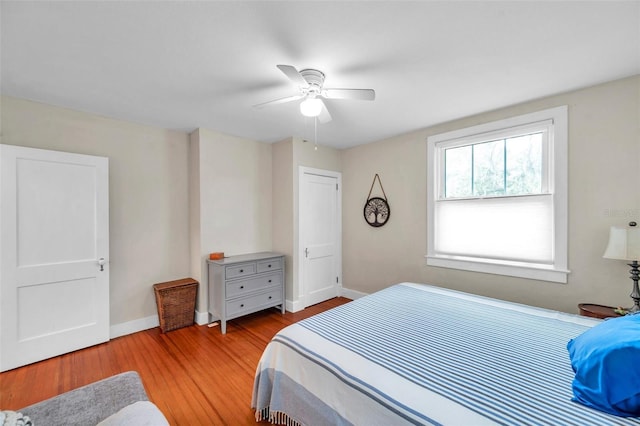320 Broadway, Dunedin, FL 34698 - bedroom featuring light wood-type flooring, baseboards, and a ceiling fan
