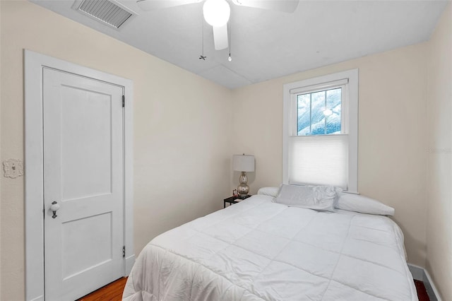 320 Broadway, Dunedin, FL 34698 - bedroom with wood finished floors, ceiling fan, and baseboards