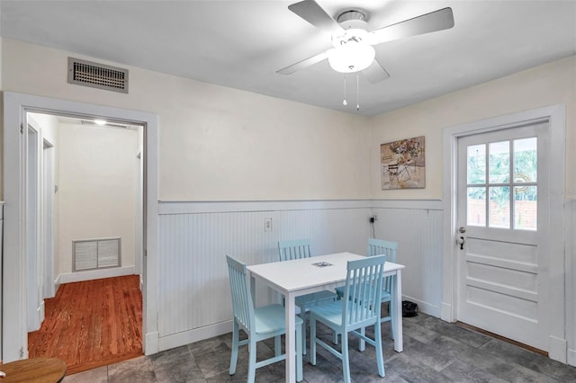 320 Broadway, Dunedin, FL 34698 - dining room featuring a wainscoted wall and ceiling fan