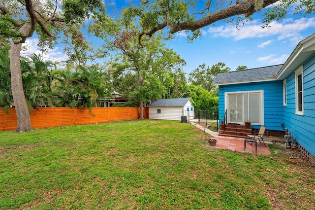 320 Broadway, Dunedin, FL 34698 - view of yard featuring entry steps, a patio, and an outdoor structure