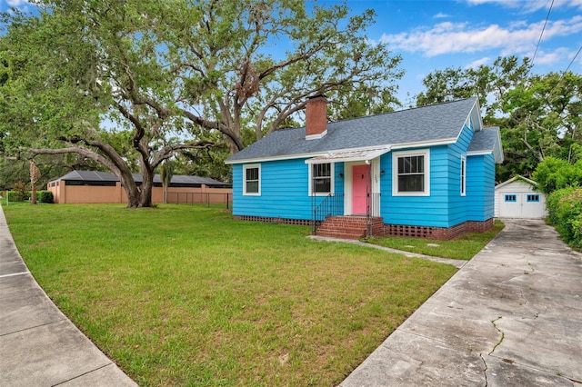 320 Broadway, Dunedin, FL 34698 - bungalow-style house featuring roof with shingles, a chimney, concrete driveway, and an outbuilding