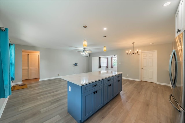 117 Connie Ave, Tampa, FL 33613 - kitchen featuring freestanding refrigerator, light wood finished floors, baseboards, ceiling fan, and recessed lighting
