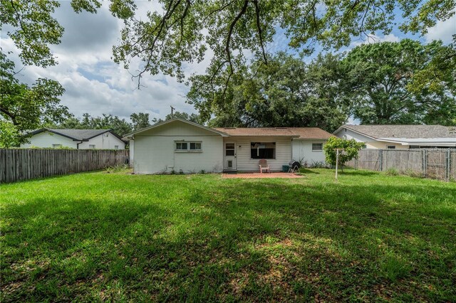117 Connie Ave, Tampa, FL 33613 - back of house featuring a patio