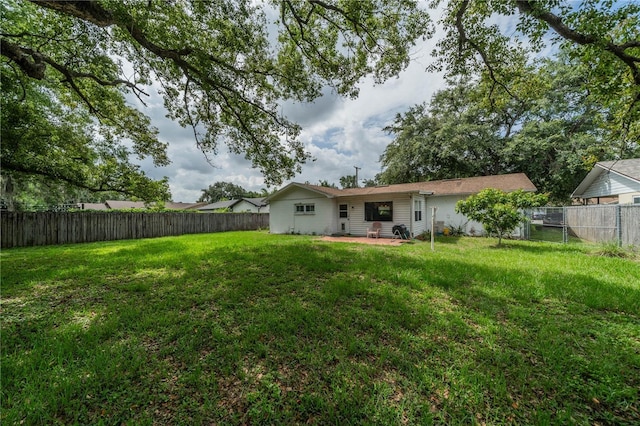 117 Connie Ave, Tampa, FL 33613 - rear view of house featuring a patio area