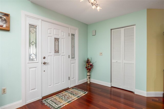 460 Meravan Dr, Palm Harbor, FL 34683 - foyer featuring dark wood-style floors and baseboards