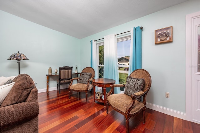 460 Meravan Dr, Palm Harbor, FL 34683 - living area with dark wood-style floors and baseboards