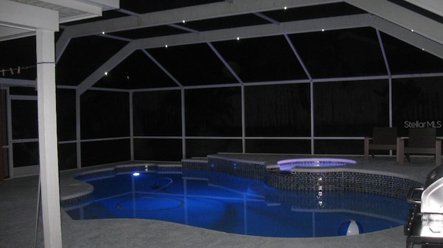 460 Meravan Dr, Palm Harbor, FL 34683 - pool at twilight with a lanai, a pool with connected hot tub, and a patio