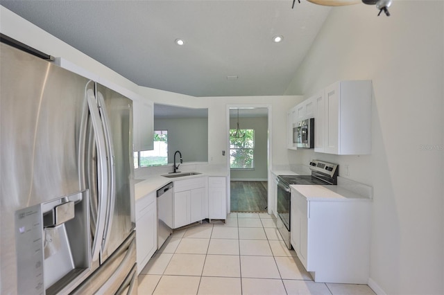 10414 Hallmark Blvd, Riverview, FL 33578 - kitchen with stainless steel appliances, a sink, light countertops, white cabinets, and recessed lighting