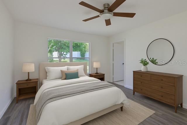10414 Hallmark Blvd, Riverview, FL 33578 - bedroom featuring wood finished floors, baseboards, and ceiling fan