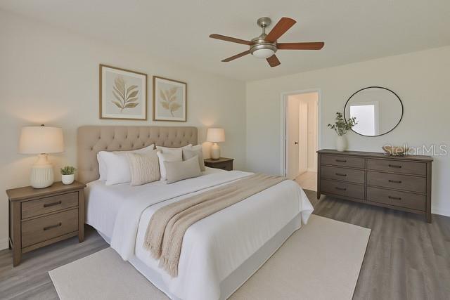 10414 Hallmark Blvd, Riverview, FL 33578 - bedroom with wood finished floors and a ceiling fan