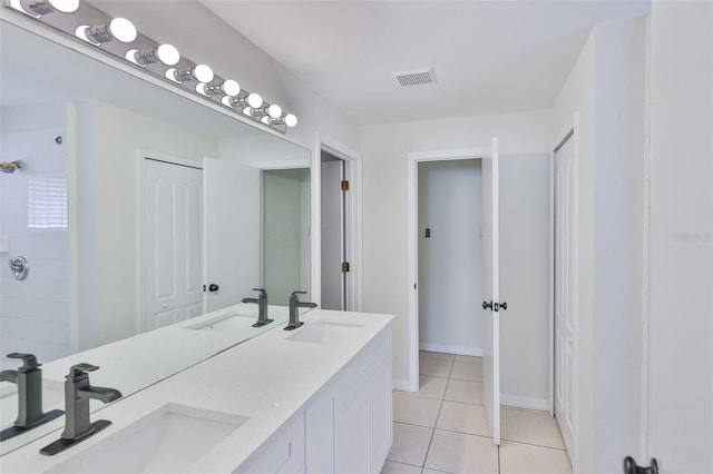 10414 Hallmark Blvd, Riverview, FL 33578 - full bathroom featuring double vanity, tile patterned flooring, baseboards, and tiled shower