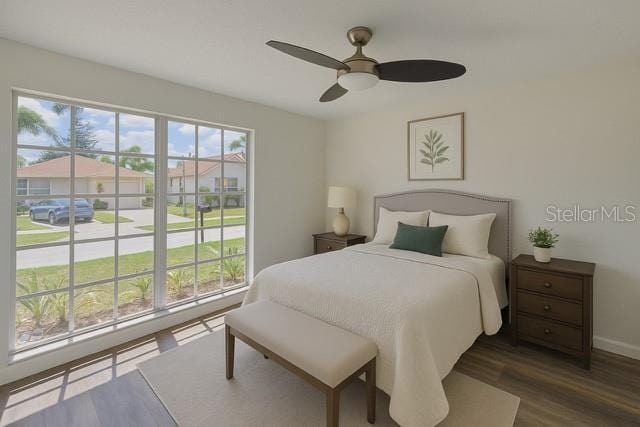 10414 Hallmark Blvd, Riverview, FL 33578 - bedroom featuring multiple windows, wood finished floors, baseboards, and ceiling fan