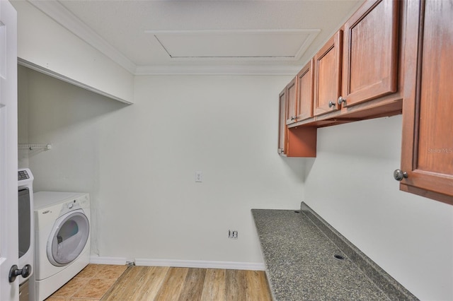 10414 Hallmark Blvd, Riverview, FL 33578 - laundry area featuring ornamental molding, washer and dryer, light wood-style floors, and baseboards