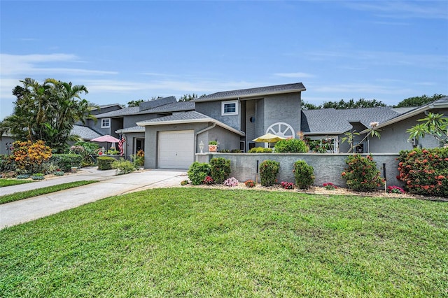 184 Hunter Ct, Palm Harbor, FL 34684 - view of front of house featuring a garage, stucco siding, concrete driveway, and a front lawn