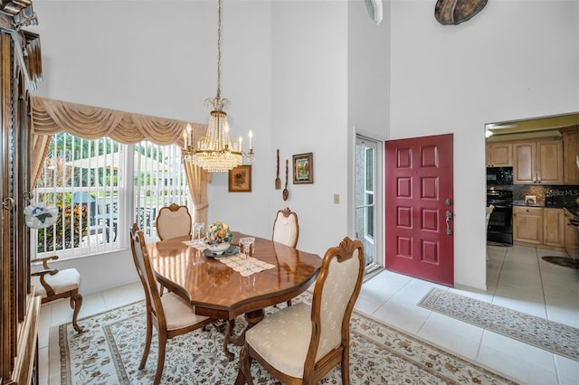 184 Hunter Ct, Palm Harbor, FL 34684 - dining area featuring a high ceiling, a chandelier, and light tile patterned floors